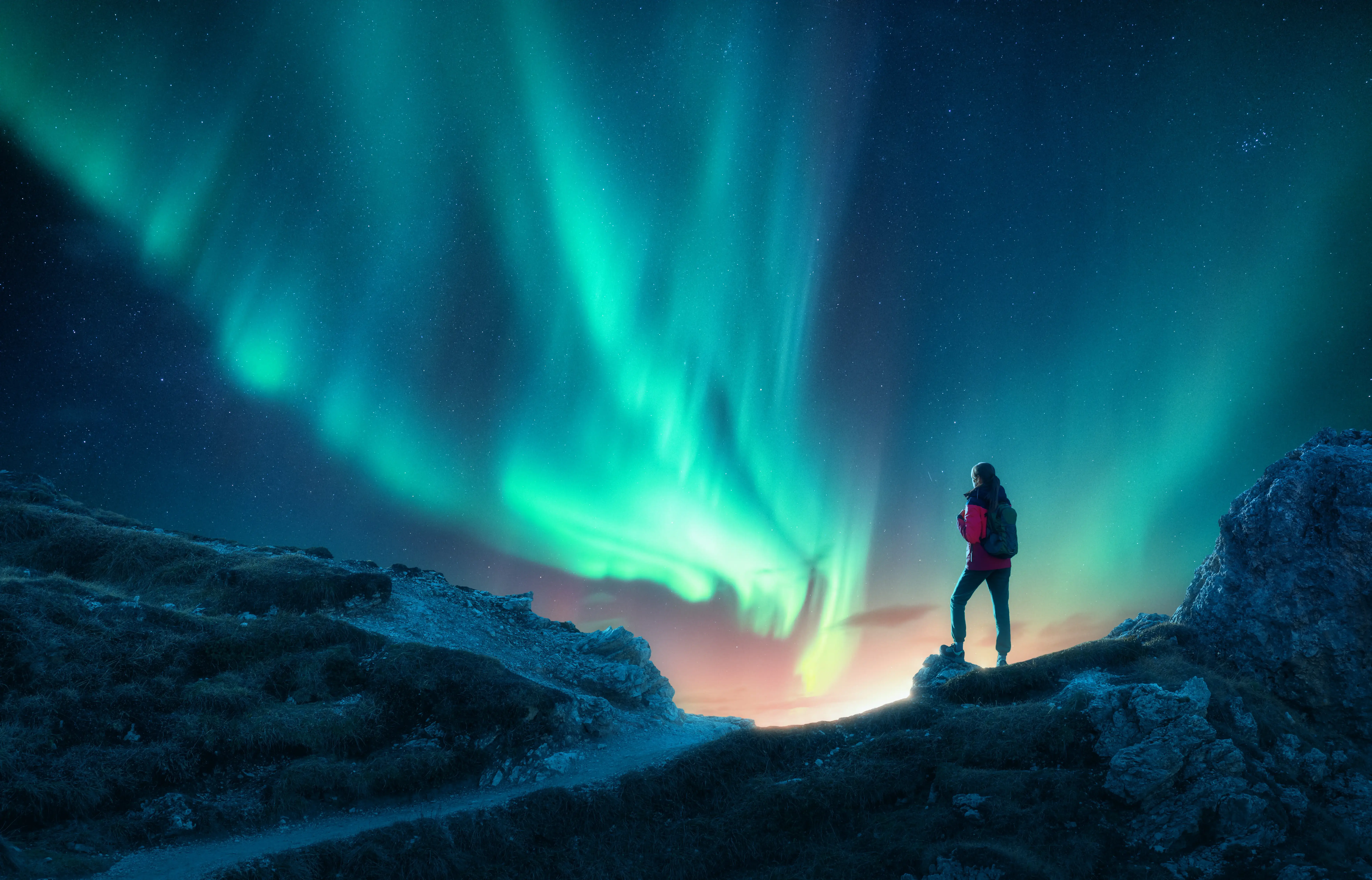 Northern lights with silhouette of person
